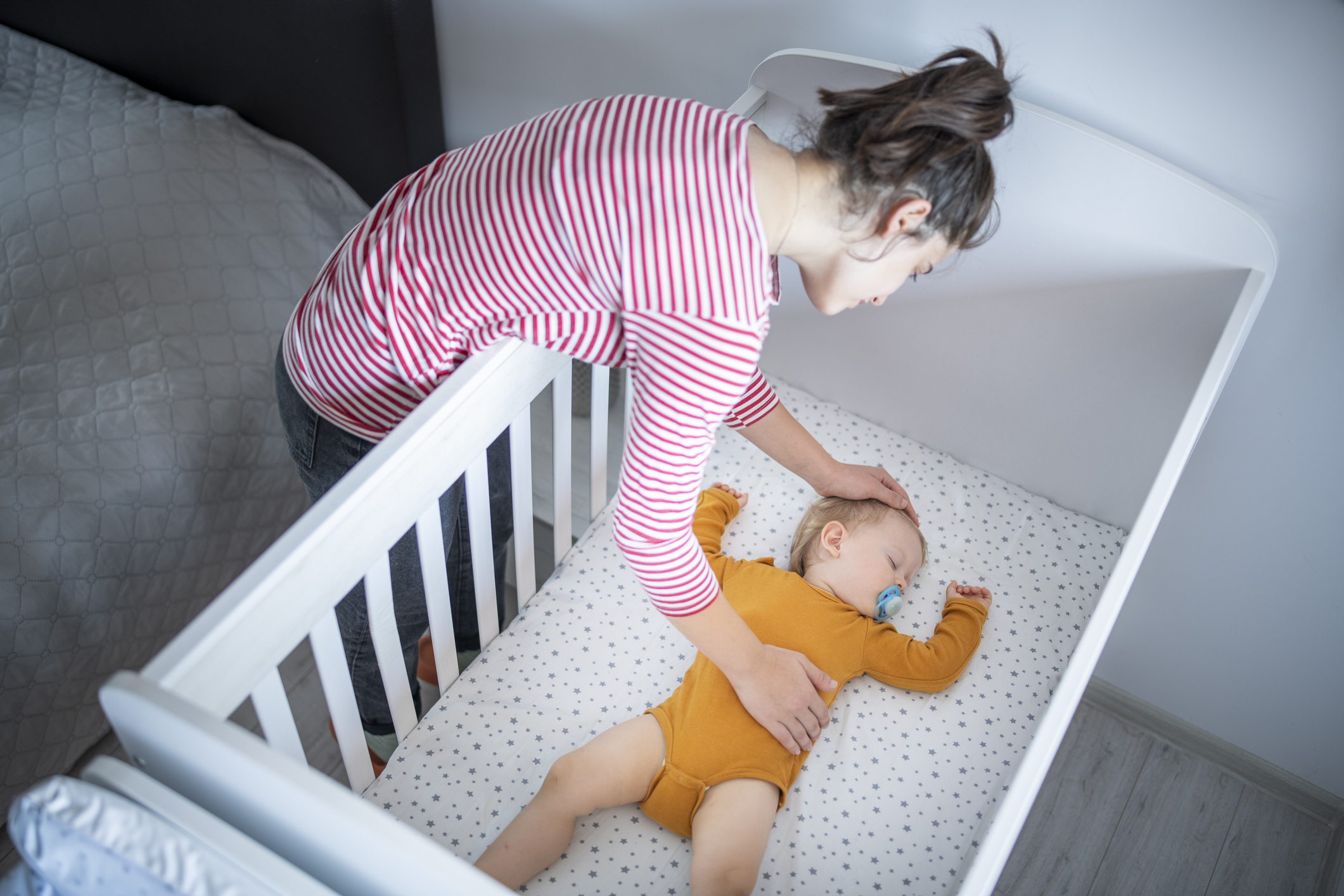 Baby in pink pyjamas sleeping 